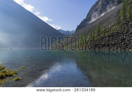 A Slight Haze Over The Surface Of The Lake. Sunny Summer Morning. The Large (lower) Shavlinsky Lake.