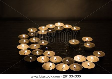 Symbols Of Islam. Candle Lights On Black Background. Abstract Isolated Photo