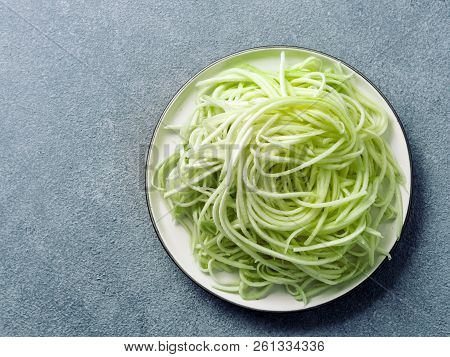 Zucchini Noodles On Plate.vegetable Noodles -green Zoodles Or Courgette Spaghetti On Plate Over Gray