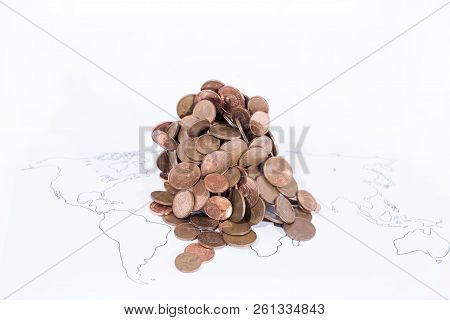 A Lot Of Coins On World Map. Abstract Photo Of World Economy
