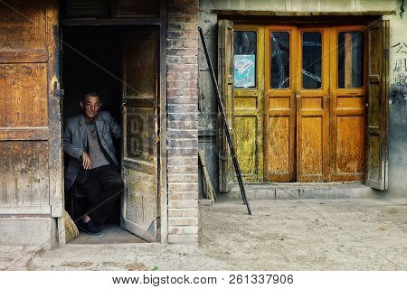 Labrang Monastery, Xiahe, Gansu Province / China - Jun 6 2011: Local Villager Sitting At His Home Do