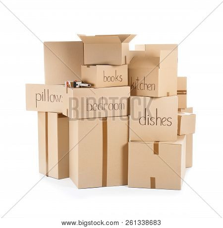 Moving Boxes And Adhesive Tape Dispenser On White Background
