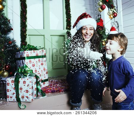 Happy Family On Christmas In Red Hats Waiting Gests And Smiling Outdoor