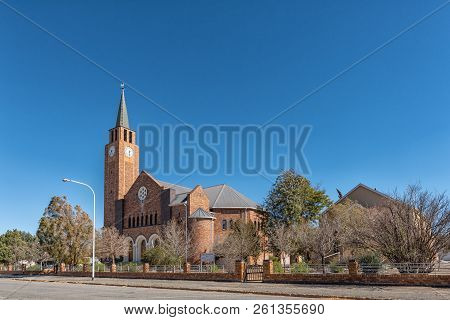 De Aar, South Africa, August 6, 2018: A Street Scene, With The Dutch Reformed Mother Church And Hall