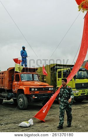 Labrang Monastery, Xiahe, Gansu Province / China - Jun 6 2011: Chinese Soldier Walking Past By Some 