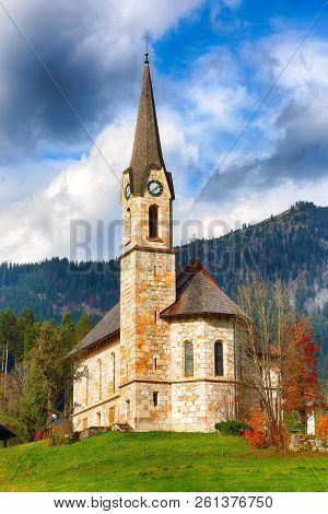 Mountains Over Gosau Village With Catholic Church Under Sunlight. Location: Resort Village Gosau Sal