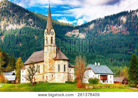 Mountains Over Gosau Village With Catholic Church Under Sunlight. Location: Resort Village Gosau Sal