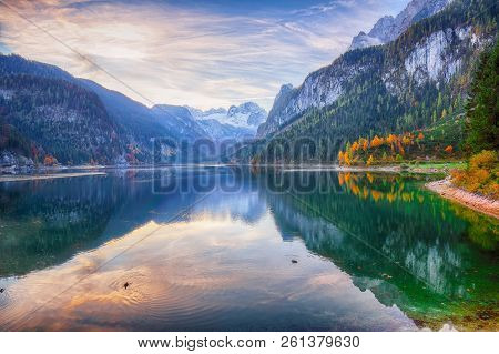 Beautiful View Of Idyllic Colorful Autumn Scenery With Dachstein Mountain Summit By Gosausee Mountai