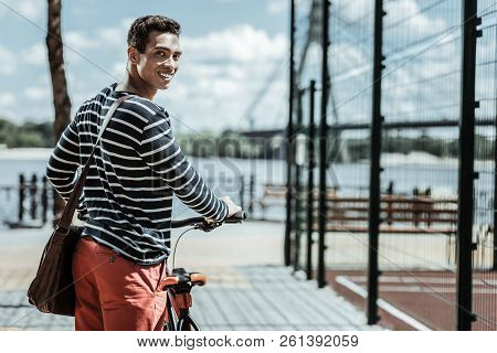 Joyful Optimistic Guy Asking Friends To Ride