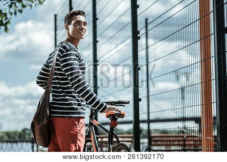Thoughtful Pretty Guy Preferring Bicycle For Riding