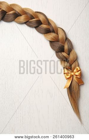 Braid And Space For Text On Light Background, Top View. Healthy Hair