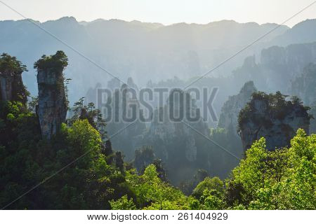 Famous tourist attraction of China - Zhangjiajie stone pillars cliff mountains on sunset at Wulingyuan, Hunan, China