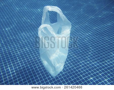 Plastic Bag Floating Into The Water. Polluted Enviromental. Recycle Garbage