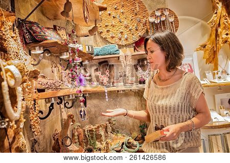 Woman Looking At Jewelry Inside A Store