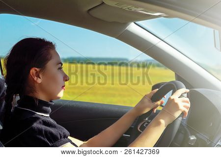 Woman Driving. Beautiful Young Business Lady Drives A Car. The Concept Of Feminism, Freedom And Inde