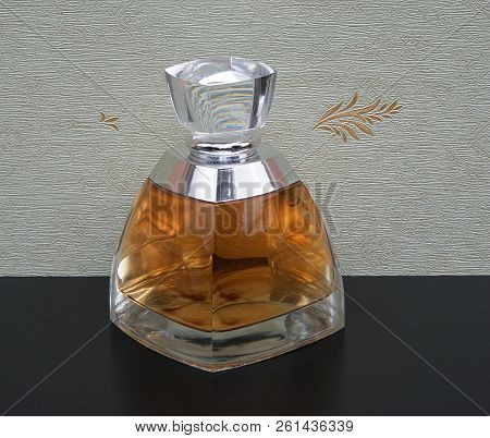 Fragrance For Ladies, Large Perfume Bottle In Front Of The Satin Wallcovering Elysee