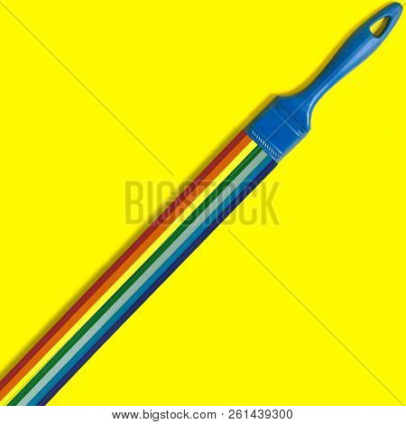 Brush With Swirling Rainbow Strips For Quilling. Artificial Object That Mimics Natural Shapes. Yello