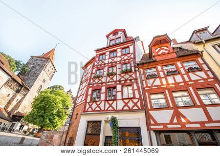 Morning Street View With Half-timbered Houses And Castle Wall In Nurnberg, Germany