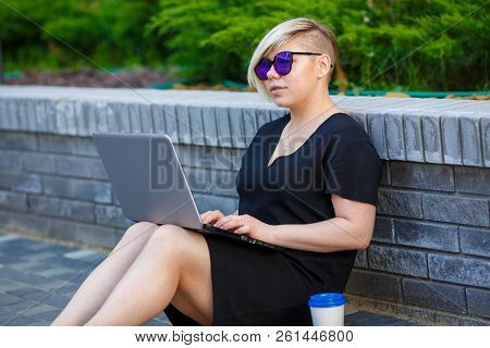 Woman Realtor Plus Size Buying, Sells, Choosing An Apartment On Laptop In Internet, Walking Outdoors