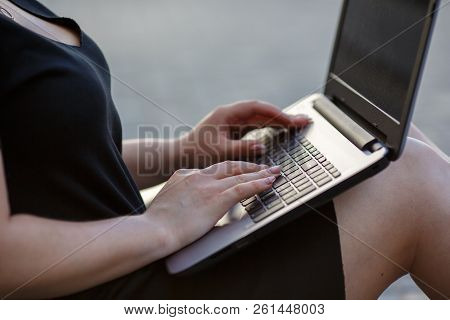 Female Hands Typing On A Laptop Keyboard, Kneeling Close Up. Freelancer Works, Looking For A Client,