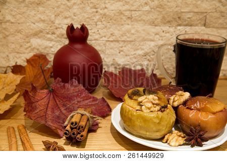 Hot Mulled Wine And Baked Apples With Spices, Honey, Cinnamon, Cloves And Anise Stars, Autumn Scene 