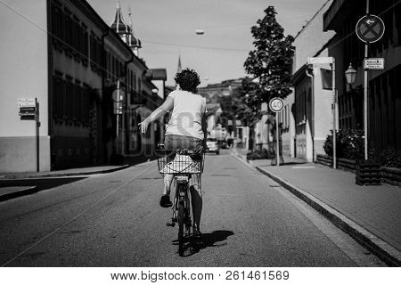 Woman Gives Hand Signal While Turning On A Country Road