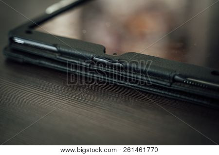 Business Tablet On Table With Reflection (closeup)
