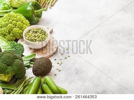 Assorted Green Toned Raw Organic Vegetables On White Background. Avocado, Cabbage, Broccoli, Caulifl