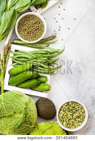 Assorted Green Toned Raw Organic Vegetables On White Background. Avocado, Cabbage, Broccoli, Caulifl