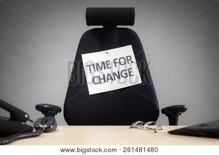 Time for change empty business chair with sign in office concept for motivation, opportunity, and progress
