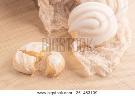 Coockies With Egg White Cover. Portuguese Sweets Known As Cavacas On Napkin In A Table.