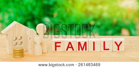 The Family With Money Is Standing Near Their House. Concept Of Wealth Life And A Happy Well-endowed.