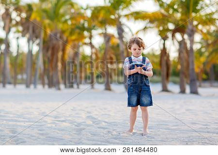 Little Kid Boy Having Fun On Tropical Beach