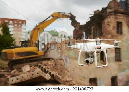 Drone operated by construction worker on building site