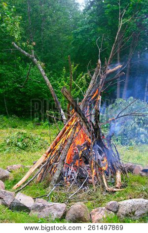 Burning Branches At The Fireplace To Celebrate Longest Day Of The Year. The Midsummer.