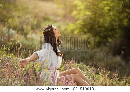 Enjoyment - Free Happy Woman Enjoying Sunset. Beautiful Woman In White Dress Embracing The Golden Su
