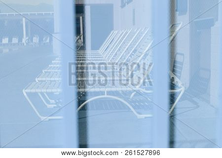 Blue Background Sheet Of Metal Covered With Lines Of Circular Holes