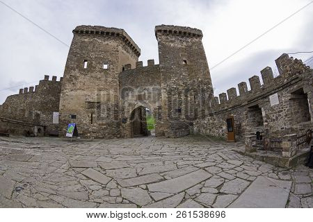 Genoese Fortress In Sudak, Crimea. Stone-paved Area Infront Of The Entrance To The Fortress, Protect