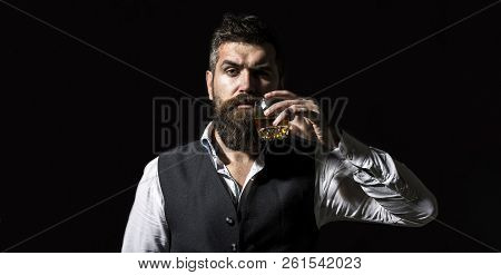 Degustation, Tasting. Man With Beard Holds Glass Of Brandy. Tasting And Degustation Concept. Bearded