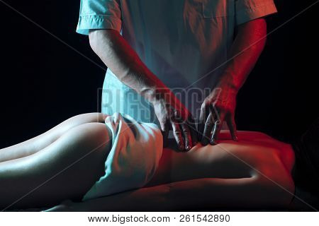 Nude Girl In Masseur. Therapy, Body Care, Massaging. Masseur Doing Massage On Woman Body In The Spa 