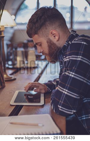 Freelancer Dressed In Casual Outfit Focus On Reading News And Lo
