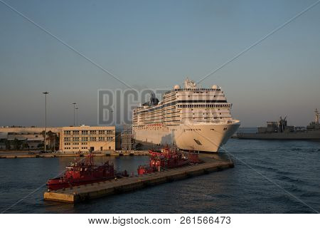 Pireaus Greece/ July 17, 2018: Cruise Ship At Dock With Fireboats In Foreground
