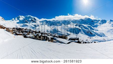 Ski in winter season, view from ski run at mountains and Val Thorens resort in sunny day in France, Alps.