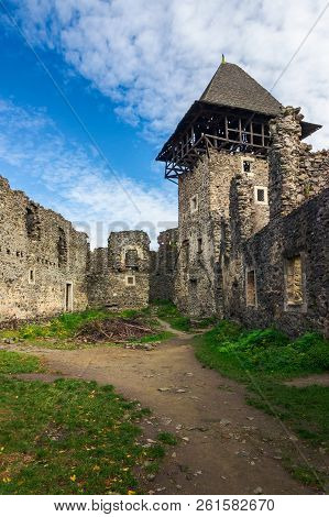 Inner Courtyard With Main Tower Of Nevytsky Castle Ruins. Popular Travel Attraction Of Transcarpathi
