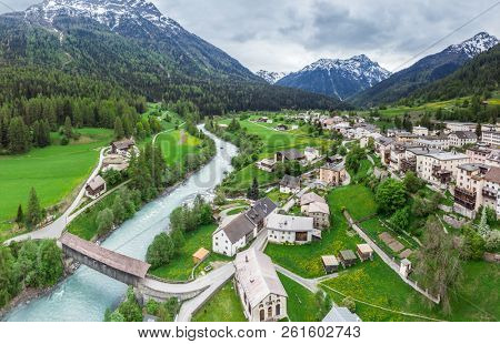 Lavin, Switzerland, May 13, 2018. Beautiful view of Lavin municipality situated on the Inn river bank between mountains. Piz Quattervals.