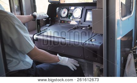 Train Driver Or Crews Is Working On The Train At Control Panel.