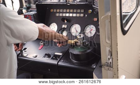 Train Driver Or Crews Is Working On The Train At Control Panel.