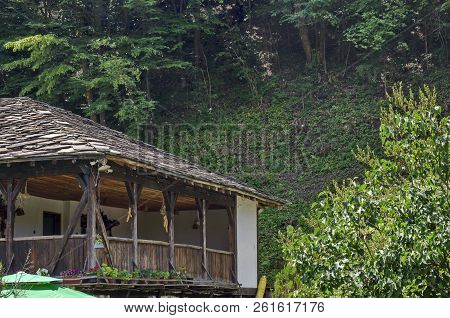 Fragment Of Old Traditional House With Balcony In Forest, Near Pasarel Village, Bulgaria