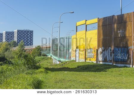 Sound Absorbing Screens Along The Highway.metal  Frames Filled With Glass,timber And Yellow Sound-ab