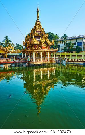 The Small Image House Of Kyay Thone Pagoda, Decorated With Golden Carved Patterns And Pyatthat Roof,